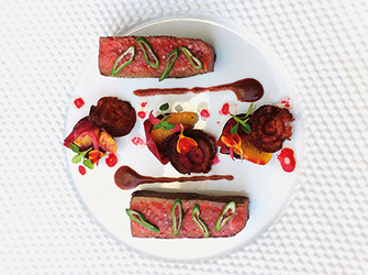 Glazed Wagyu beef piece, Alsacian pinot noir dreg sauce,beetroot and blood orange.