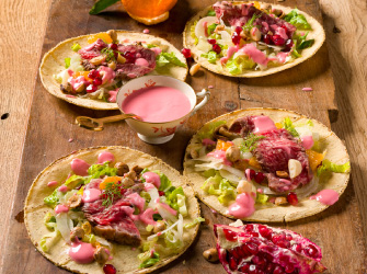 Piadina with Sicilian fennel and mandarin salad, cut of Japanese Wagyu meat, pomegranate sauce and hazelnuts