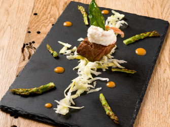 Cube of Wagyu fried in grape oil, steamed langoustine, bisque, white cabbage and sautéed asparagus