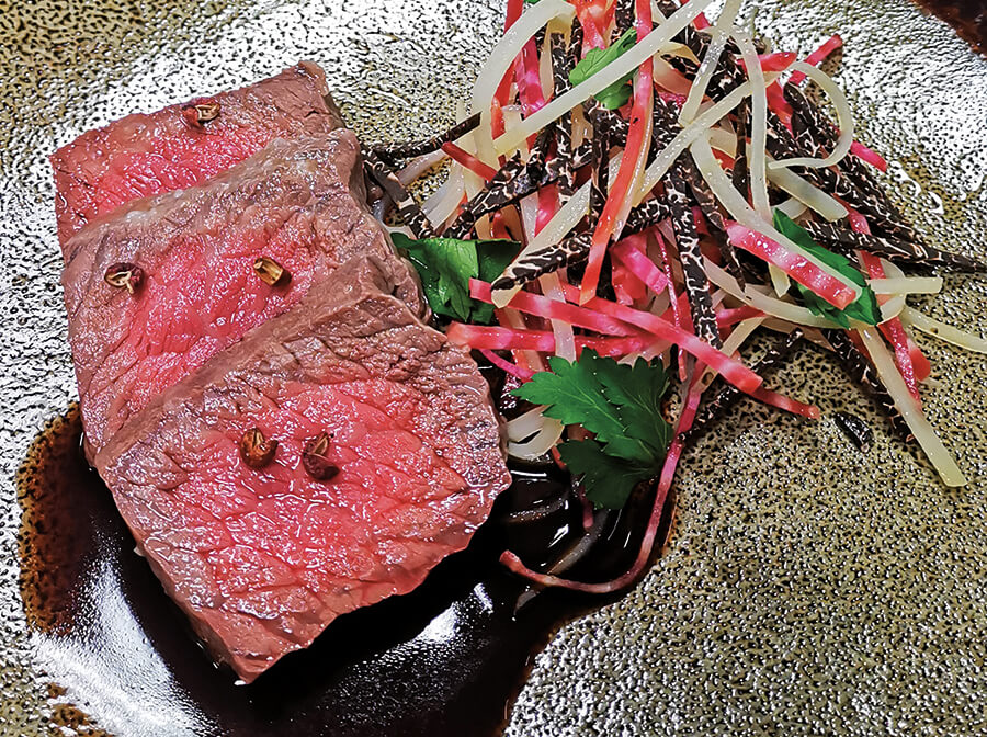 Wagyu's gooseneck round in salt and bee balm crust with potato, beetroot and truffle salad, topped with beef jus and mushrooms