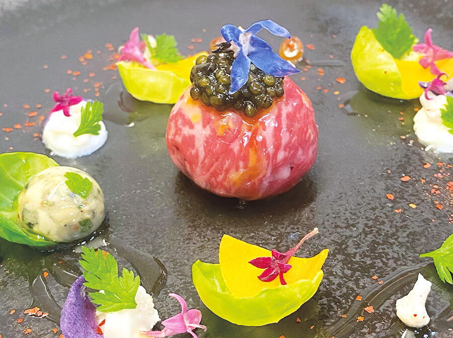 Wagyu beef tartar with Camargue oysters and caviar, a hint of tanginess with winter vegetables